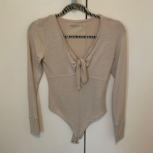 Xs tan Abercrombie soft AF body suit. Never worn